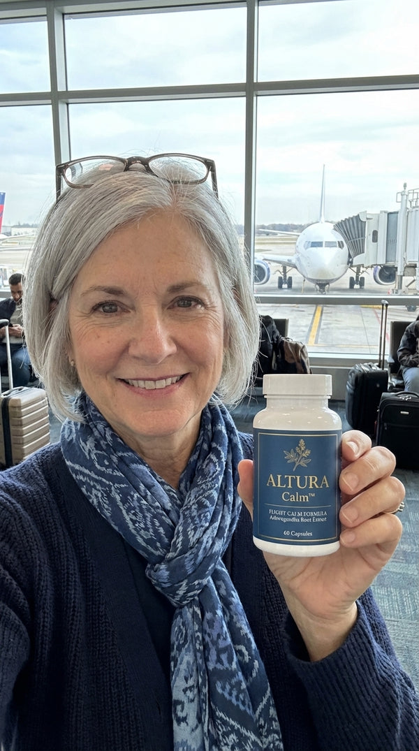 UGC selfie - woman at airport gate with Altura Calm bottle